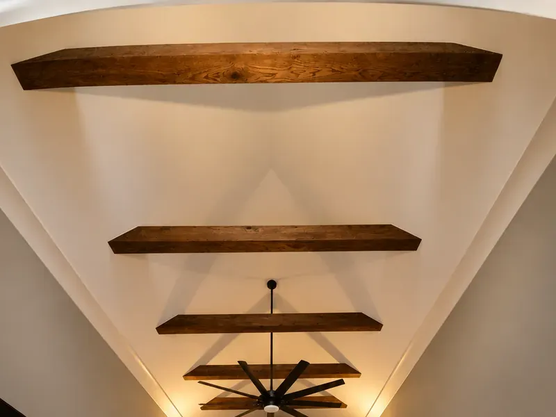 Design concept of dark wood beams across a vaulted ceiling