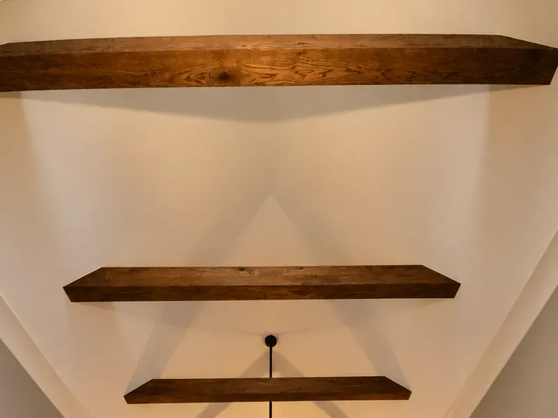 Design concept of evenly spaced wood beams across a vaulted ceiling
