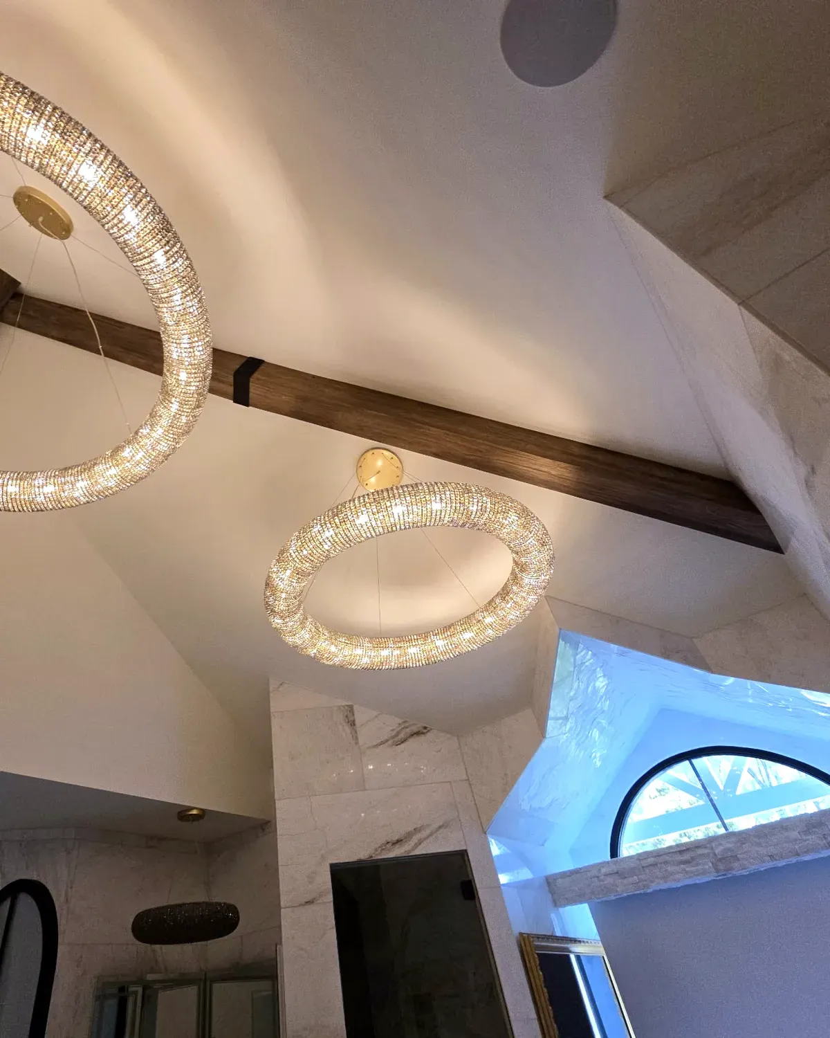Dark stained real wood ceiling beam on a vaulted ceiling, built and installed by Chava Grain & Beam by Chava Home Design