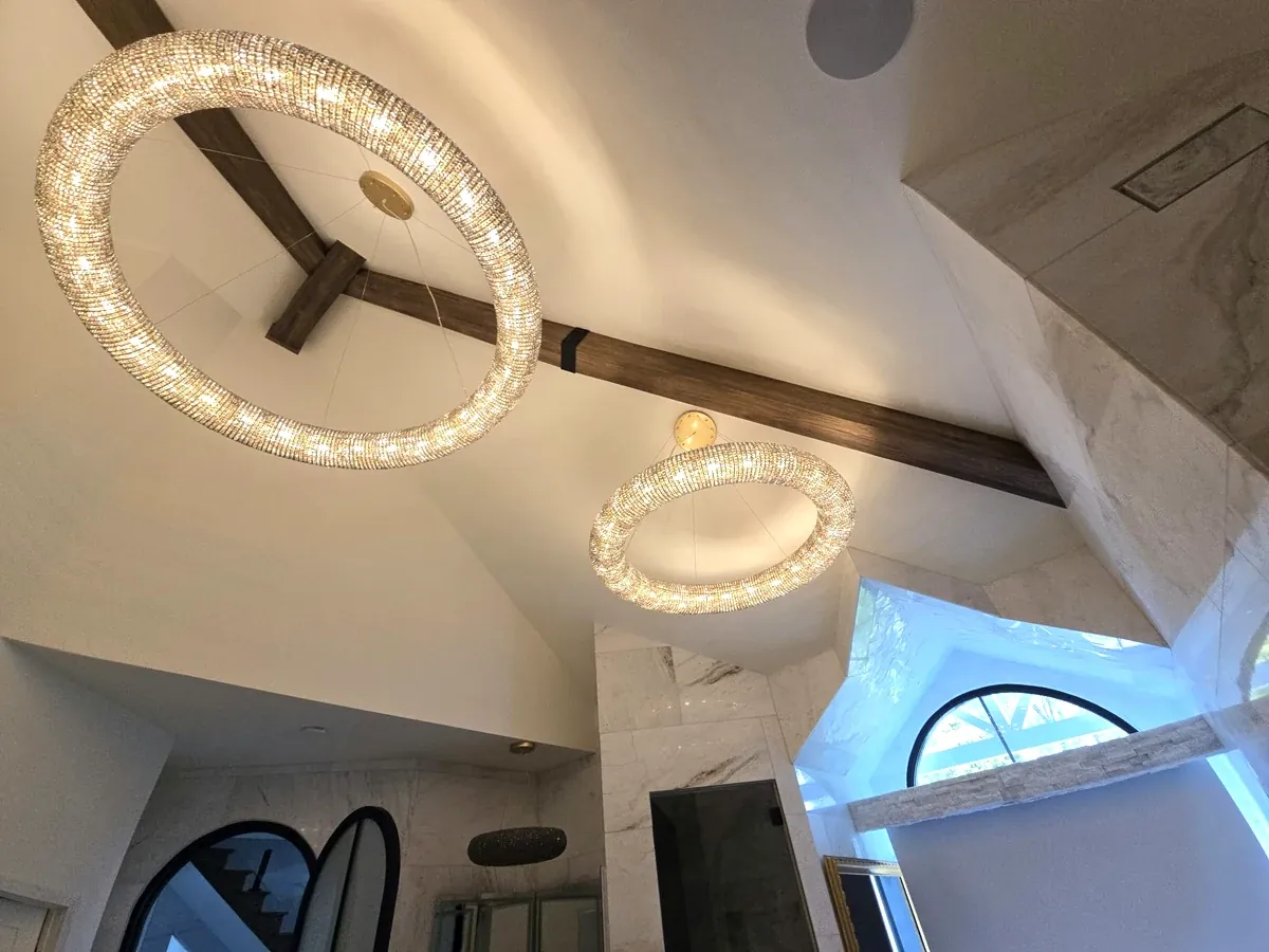 A real wood beam installation photographed in a finished living room